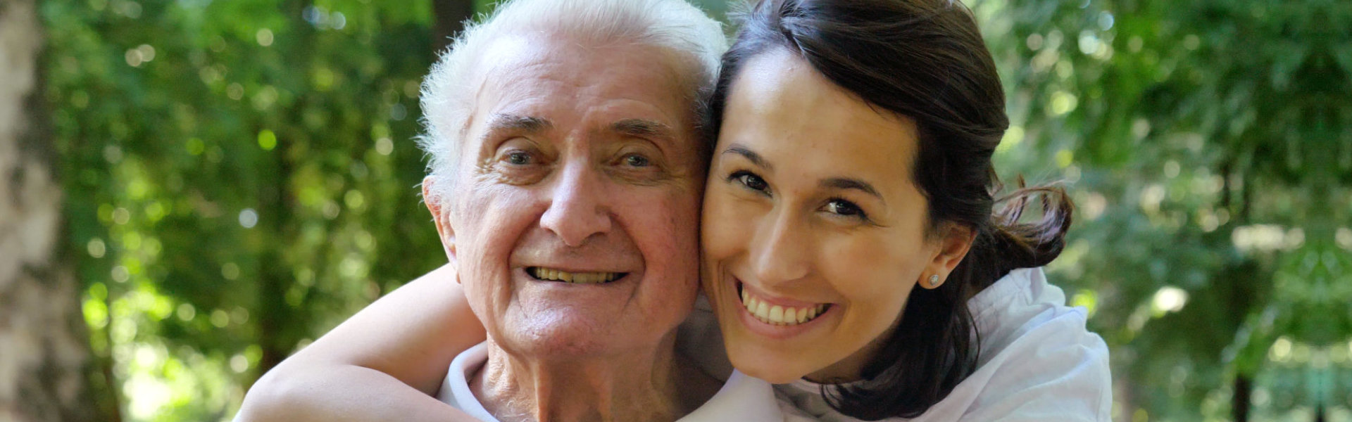 smiling caregiver and elderly man