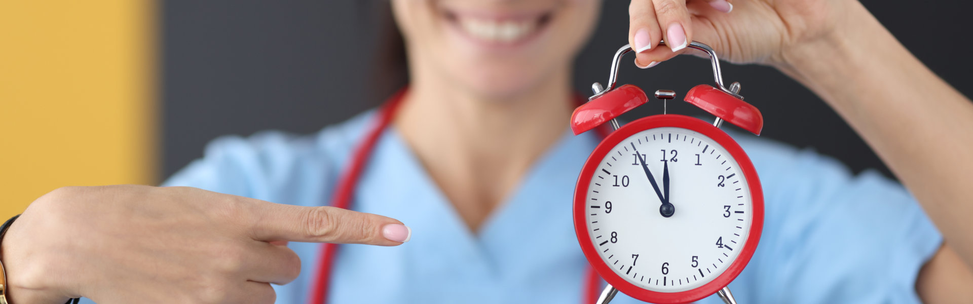 caregiver holding a clock