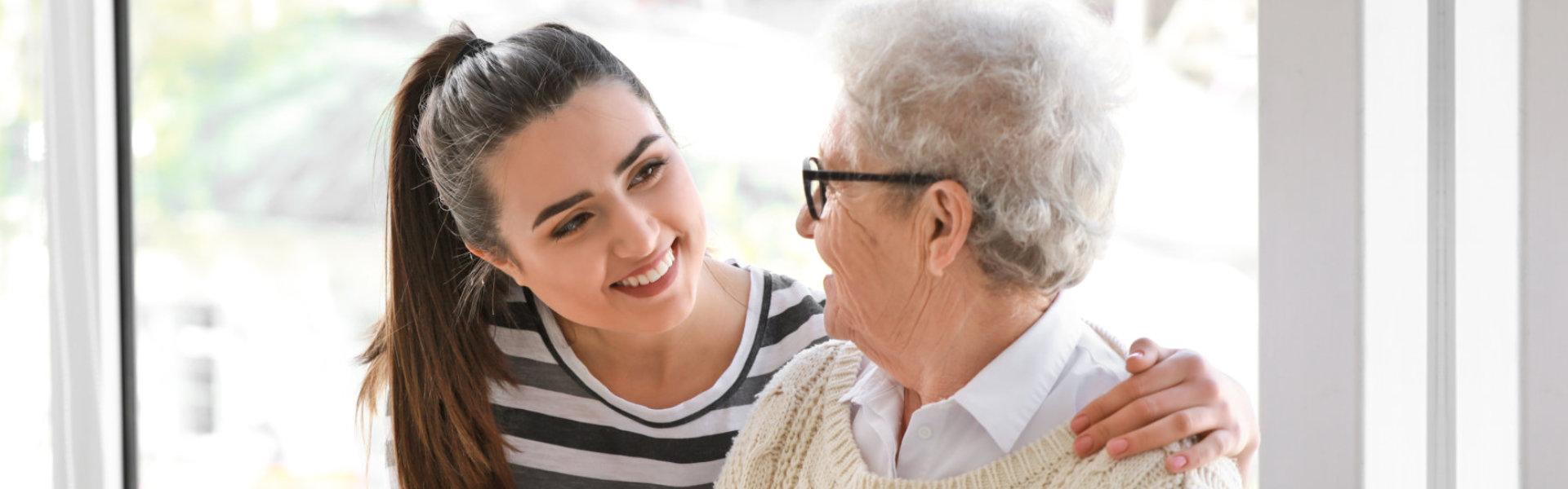 elderly woman with her caregiver